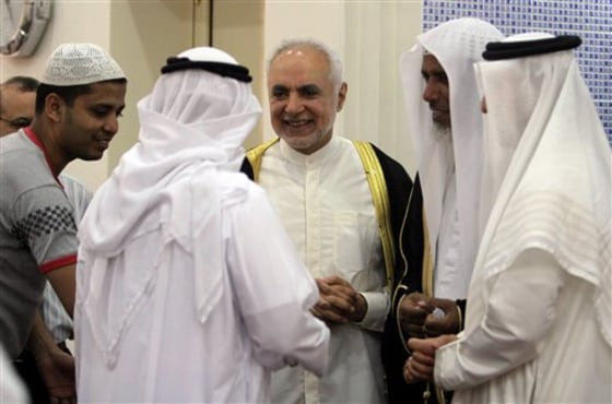 Imam Feisal Abdul Rauf, center, greets worshipers inside a Muharraq, Bahrain, mosque after leading midday prayers Friday. Rauf is leading plans for an Islamic center near the site of the Sept. 11 attacks on New York.
